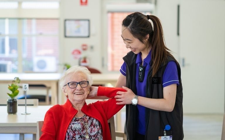 Physio helping an elderly women